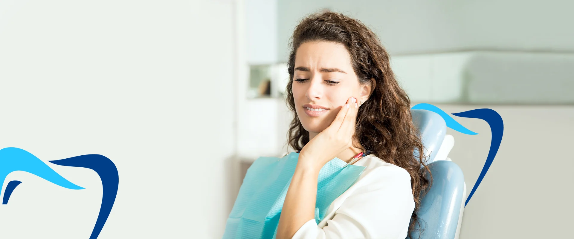 Girl in teeth pain sitting in dental clinic
